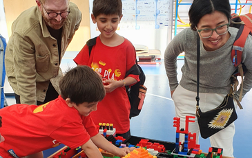 Children with indoor lego builds